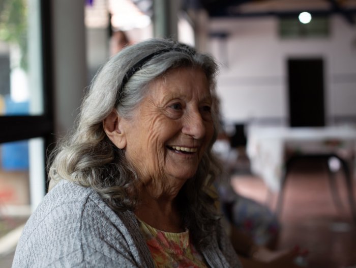 elderly woman smiling in aged care facility